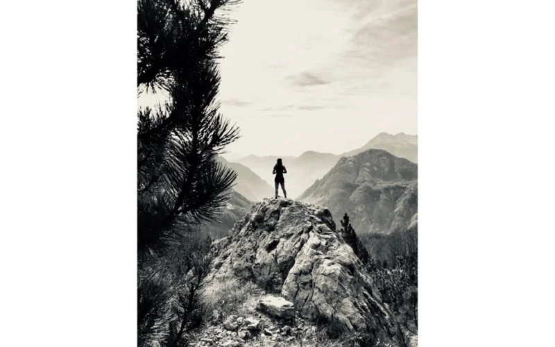 Woman standing on a rock in Theth, Albania
