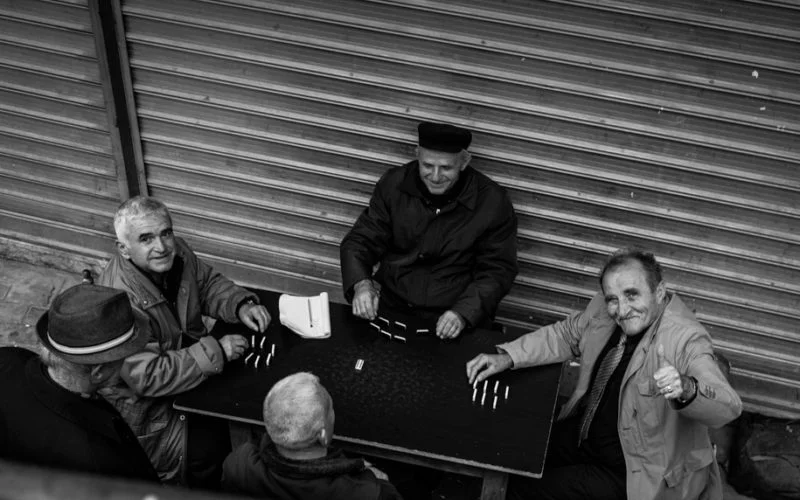 Old man playing game, Albania