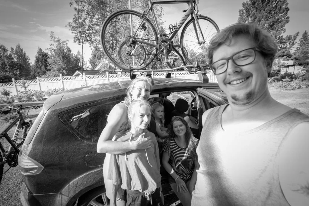 Black and white selfie of Ellis and me and a family